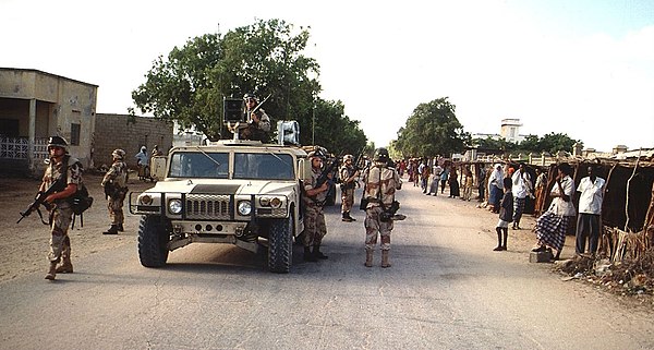 US soldiers coming down a street in Kismayo (1993)