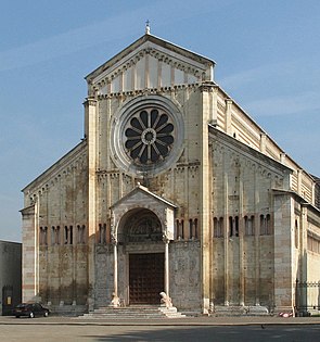 Church of San Zeno, Verona, Italy, The facade is neatly divided vertically and horizontally. The central wheel window and small porch with columns resting on crouching lions is typical of Italy.