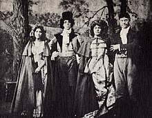 Cast of When Knights Were Bold (1908), from left: Linda Arvidson, director D. W. Griffith, unknown player, and Harry Solter. When Knights Were Bold 1908.jpg