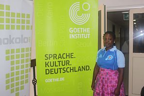 Safurat Balogun ,The head, Information and Library Goethe-Institut, Lagos.Posing behind her organisation's banner at the event