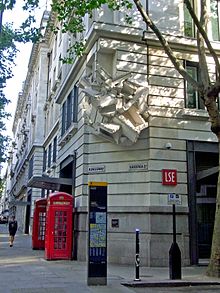 London School of Economics buildings on the corner of Kingsway and Sardinia Street featuring a sculpture by Richard Wilson. Wikimania 2014 - 0803 - Kingsway Sardinia St220411.jpg