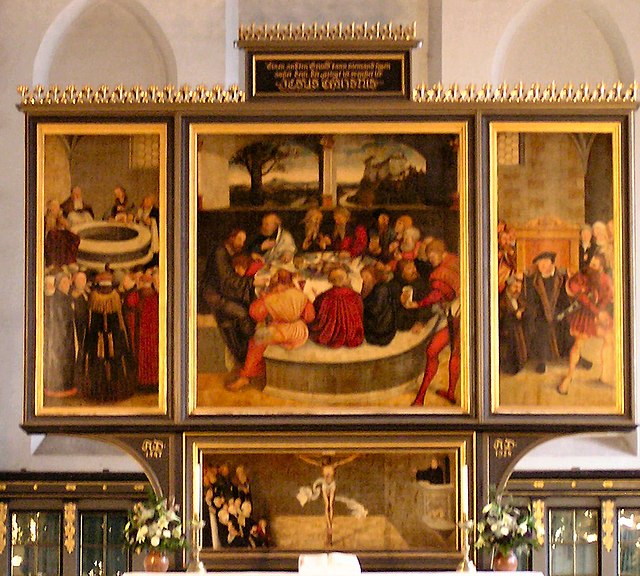 Cranach the Elder's Wittenberg Altarpiece. An early Lutheran work depicting leading Reformers as Apostles at the Last Supper.