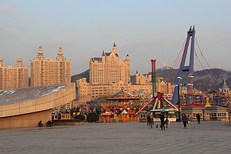 Xinghai Square amusement park with the Castle Hotel in the background