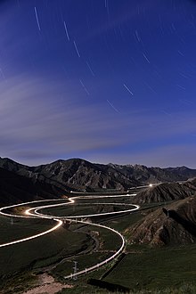 Guanjiao Spiral on Qinghai-Tibet Railway at night. The route containing the spiral was replaced by a 32-km long tunnel (at the time of completion the longest in China) in 2014. Xun Dao Gong Chu Pin photo by Xundaogong----Guan Jiao BMen  - panoramio.jpg
