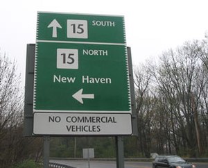 A sign stating Route 15 south to New Haven to the left: It also states Route 15 north is straight ahead.