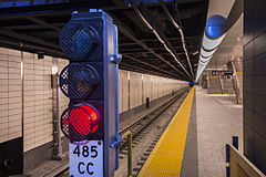 CBTC is being overlaid onto the traditional block signaling system. For example, this block signal located at the 34th Street-Hudson Yards station on the IRT Flushing Line, is being automated. 34 St-Hudson Yards Station (21389427245).jpg