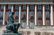 The statue of Abraham Lincoln outside the Maxwell School of Citizenship and Public Affairs Abraham Lincoln Statue and Maxwell School, Syracuse University, 2012.jpg