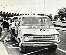 A Dodge Maxivan operated by BART at Oakland International Airport in 1977, the same year NECTAR introduced vans of the same model. AirBART bus at Oakland International Airport, 1977.jpg