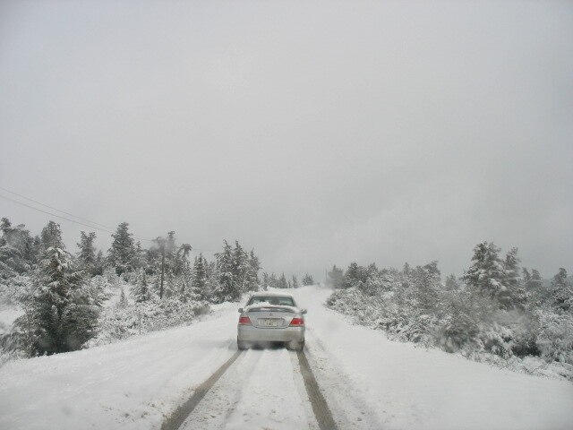 A snowy road on the outskirts of the city