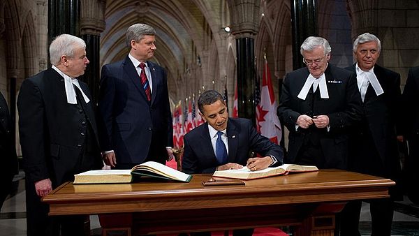 Milliken (left) along with Prime Minister Stephen Harper as US President Barack Obama signs the Parliament guest book on February 19, 2009