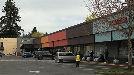 Long line of people queued up in front of the BottleDrop redemption center in East Portland in April 2020. Beverage Container Redemption Center in Oregon .jpg