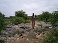 osmwiki:File:Black meta-limestone outcropping near Taget.jpg