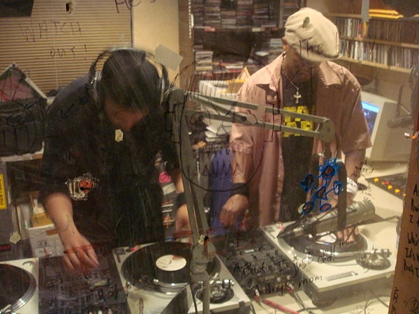 Two DJs practicing turntablism