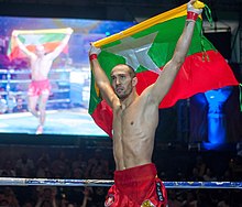 Leduc raising the Myanmar flag in Yangon, 2018 Dave Leduc - MLWC 2018.jpg