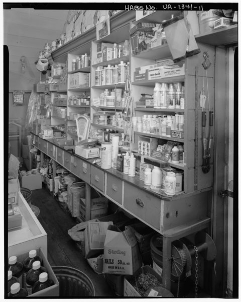 File:Detail view of the original counter and built-in merchandise drawers along the store's east wall; open shelving for dry goods can be seen above the counter; looking northeast - HABS VA,45-HORPA,1-11.tif