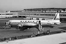 Riddle Airlines Douglas DC-7 at JFK International Airport (July 1962) Douglas DC-7C Seven Seas, Riddle Airlines JP7357286.jpg