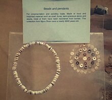 The beads and pendants forming this c. 3,000-year-old neck chain are of the Elmenteitan culture and were among the finds at Njoro River Cave. Elmenteitan pendant.jpg