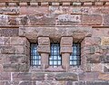 The windows in the holes of the tower