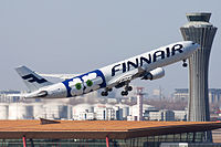 Finnair Airbus A330-302 "Marimekko" taking off at BJS.jpg