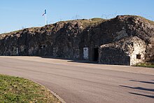 Remains of Fort Vaux, Le Vaillant's plaque is to the left of the entrance Fort Vaux, France.jpg