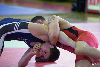Compared to collegiate (scholastic or folkstyle) wrestling, the main style done in U.S. high schools, colleges, and universities, freestyle wrestling involves a greater emphasis on explosive action by both wrestlers, as opposed to one wrestler's dominance and control of the other.
