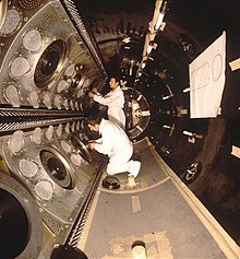 The inside of the bubble chamber. The fish-eye lenses can be seen on the walls of the chamber. Gargamelle chamber at CERN, November 1970.jpg