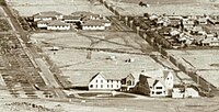 Gorman House (top left) in 1928 before the two story buildings were added. The Hotel Ainsley is at the bottom right. Gorman House 1928.2.jpg