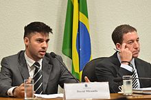 Glenn Greenwald (right) and his partner, Brazilian David Miranda (left), speaking to the National Congress of Brazil about U.S. spying activity in that country. Greenwald and Miranda at Congress.jpg