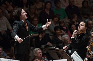 Gustavo Dudamel, pictured here in 2009, conducted the New York Philharmonic and Los Angeles Philharmonic during the film's recording sessions. Gustavo Dudamel conducts the Simon Bolivar Youth Orchestra at London's Royal Festival Hall.jpg