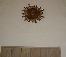 Solsymbol med tetragrammet JHWH i mitten.