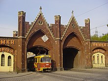 A Tatra T4 Tram passing through the Brandenburg Gate