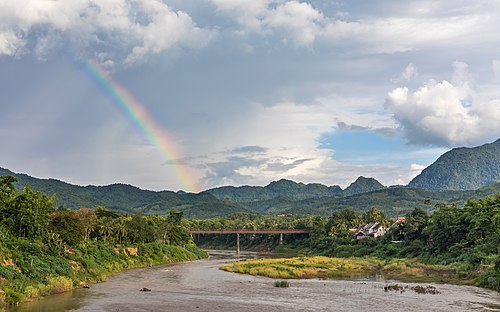 Landscape with rainbow and the Old Bridge over the Nam Khan river