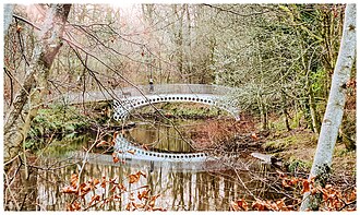 The "Halfpenny Bridge" over the White Cart River Linn Park Glasgow.jpg