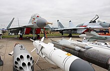 A MiG-29K and its armaments at MAKS Airshow. The folded wings maximise the limited space available on an aircraft carrier.