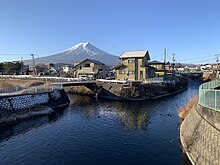 Mount Fuji and the confluence of Miya and Nakazawa River from Gekkō Bridge