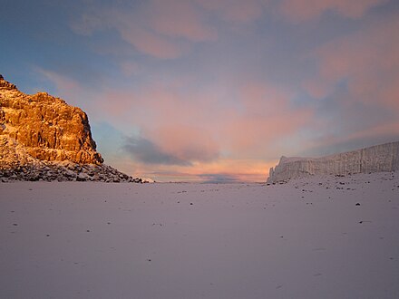 Down in the caldera of Kilimanjaro with the high point of the rim to the left just as the suns was rising