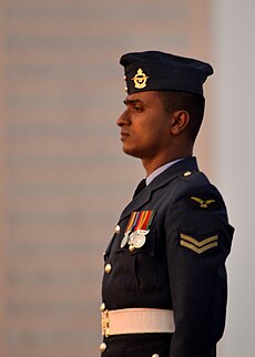 An Air Force serviceman in parade uniform, with medals pinned on left breast Sri Lankan Airforce Soldier.JPG