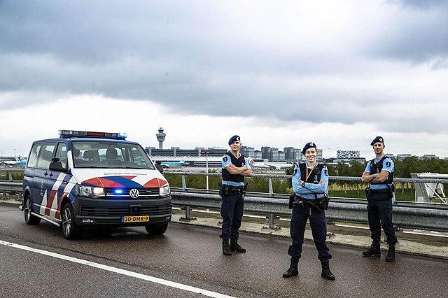 Marechaussee patrol car and officers