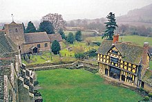 The courtyard, with the 13th-century south tower and solar block (l), the church (c) and the 17th-century wood and plaster gatehouse (r) Stokesay, castle courtyard and parish church - geograph.org.uk - 499686.jpg