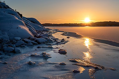 Sunset over the ice of Brofjorden