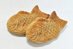 Two fish-shaped, somewhat flat pastries