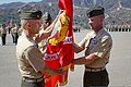U. S. Marine Lieutenant Colonel Kevin A. Norton (right) relinquishes command of 1st Battalion, 4th Marine Regiment, to Maj. Christopher J. Bronzi as he hands him the battalion colors during a change of command 120906-M-XZ164-028.jpg