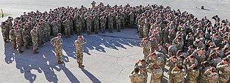Advisors from the 3rd Security Force Assistance Brigade don their brown berets at a ceremony standing up the unit US Army 3rd SFAB beret ceremony.jpg