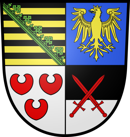 The coat of arms of Saxe-Lauenburg as fixed by Duke Julius Francis and confirmed by Leopold I, Holy Roman Emperor, in 1671. First quarter: the Ascanian barry of ten sable and Or, covered by a crancelin of rue bendwise in vert.[1] Second quarter: azure, an eagle crowned Or. Third quarter: argent, three water lily leaves gules. Fourth quarter: party per fess sable and argent, the electoral swords (German: Kurschwerter) gules, representing the Saxon office as Imperial Arch-Marshal (German: Erzmarschall, Latin: Archimarescallus), pertaining to Saxon privilege as Prince-elector, besides the right to elect the new emperor after the decease of the former. Saxe-Lauenburg always claimed the privilege, but could not prevail after 1356.