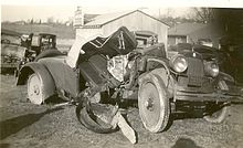 A wrecked car at the corner of U.S. Route 1 and Whiskey Bottom Road in 1927 Whiskey Bottom Road and US Route 1 Intersection.jpg