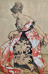 Femme en robe rouge avec des éléments blanc, assise.