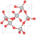 Crystal structure of α-quartz (red balls are oxygen, grey are silicon)