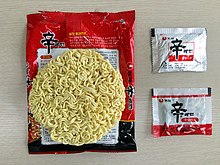 A packet of Shin Ramyun, the Chinese character Xin , meaning 'spicy', is prominently displayed sinramyeon(bongjimyeon) guseongpum.jpg