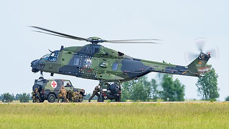 English: German Army (Heer) NHIndustries NH90 TTH (reg. 78+31, cn unknown) and Mercedes-Benz 250 GD "Wolf" of the German Armed Forces at ILA Berlin Air Show 2016.