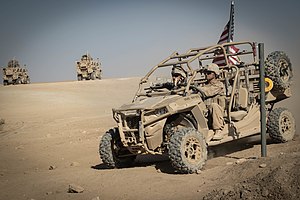 U.S. Marines with 3rd Battalion, 7th Marine Regiment, 1st Marine Division attached to Special Purpose Marine Air-Ground Task Force, Crisis Response-Central Command (SPMAGTF-CR-CC) drive a Utility Task Vehicle around security positions at Fire Base Um Jorais (FB UJ) 4 July 2018. (Cpl. Carlos Lopez/Marine Corps) 7th Marine Regiment, 3rd Battalion, 1st Marine Division, Fire Base Um Jorais.jpg